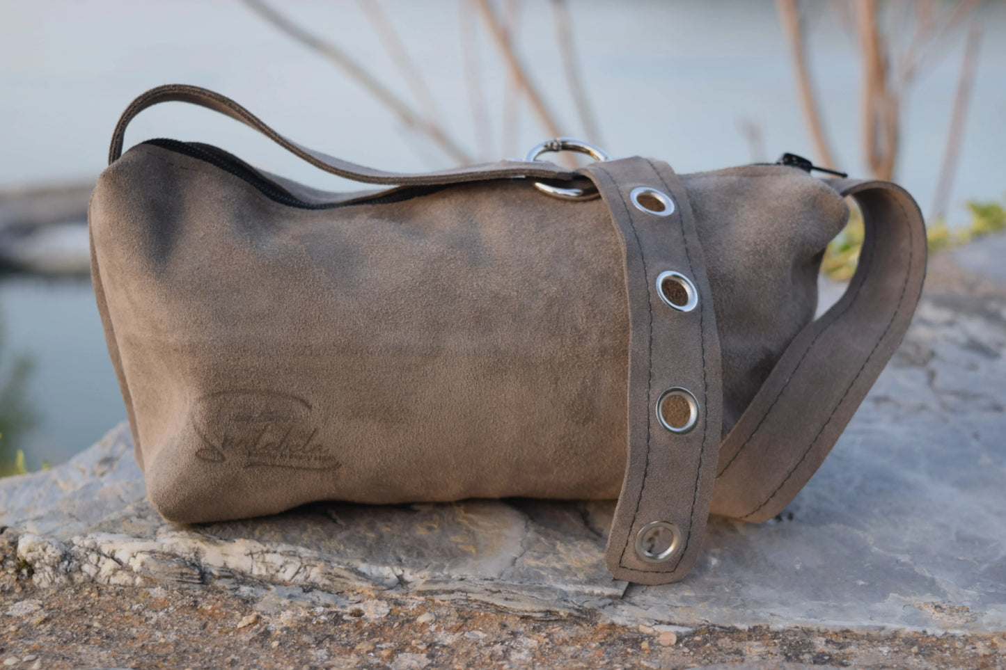 Handcrafted Luna crossbody bag in soft gray leather with subtle detailing. Santebela handcrafting