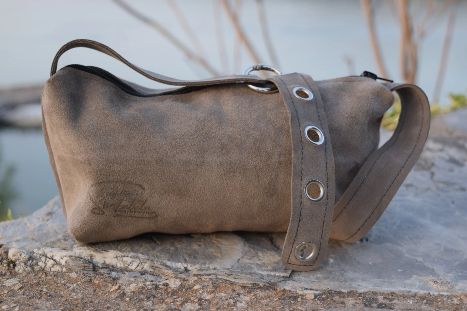 Handcrafted Luna crossbody bag in soft gray leather with subtle detailing. Santebela handcrafting
