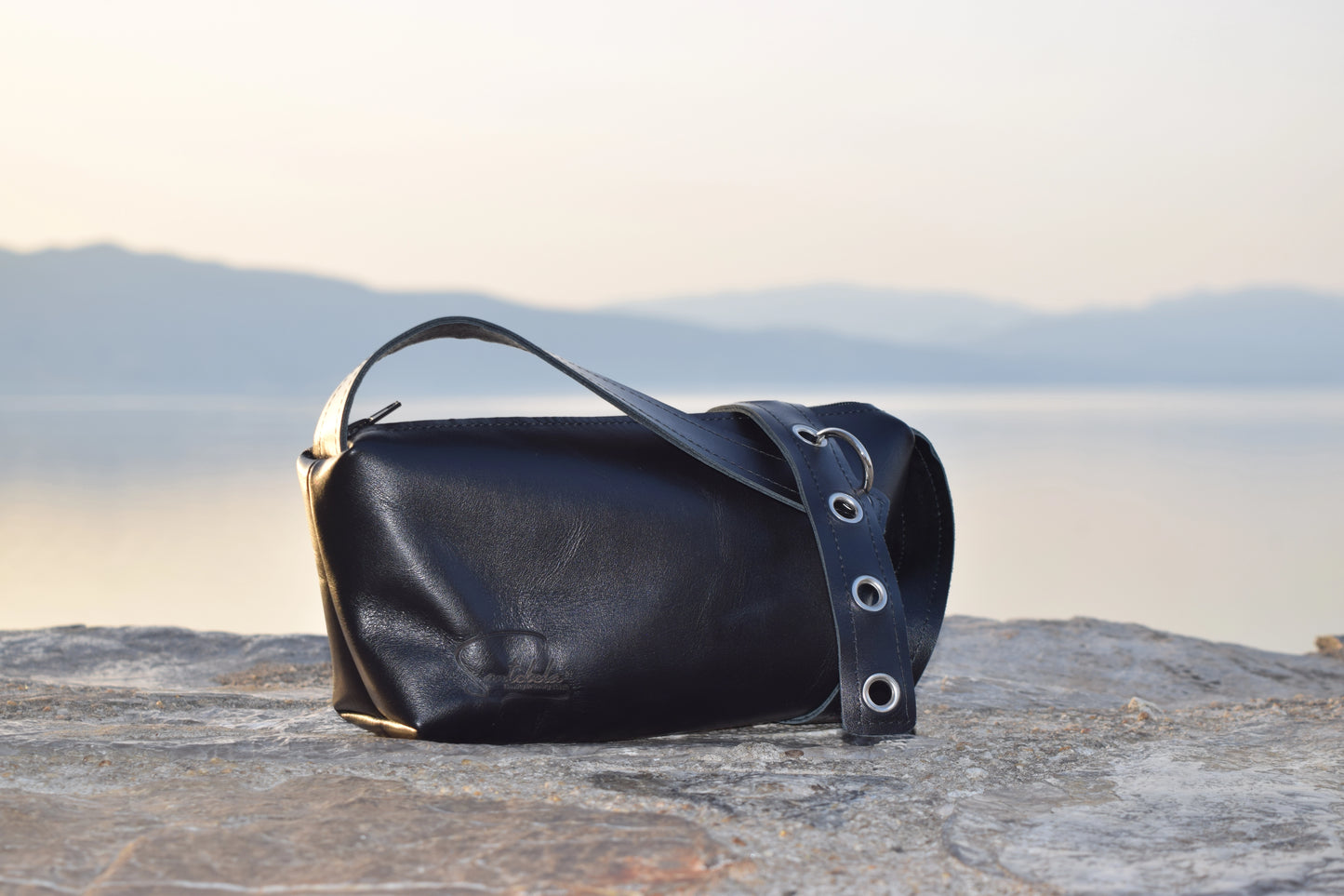 Elegant designer crossbody bag in premium Italian goat leather with silver rings and O-ring detail – timeless handmade craftsmanship by Santebela.