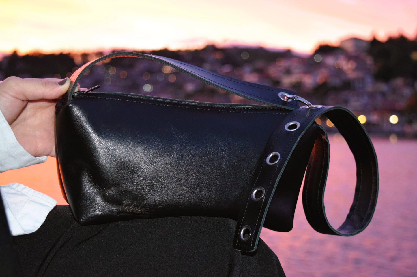 Black Italian leather crossbody bag with orange sunset, a perfect elegance handmade by Santebela.