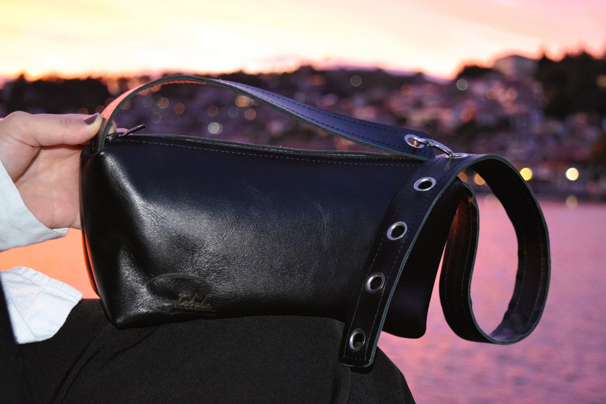 Black Italian leather crossbody bag with orange sunset, a perfect elegance handmade by Santebela.