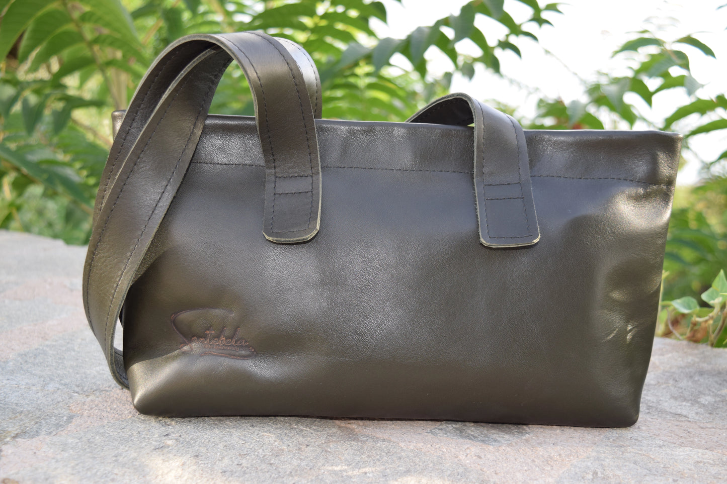 Lifestyle shot of the Dark Green Olive Leather Tote Bag, styled with elegance and versatility for everyday wear, by Santebela