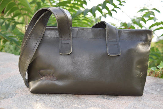 Lifestyle shot of the Dark Green Olive Leather Tote Bag, styled with elegance and versatility for everyday wear, by Santebela
