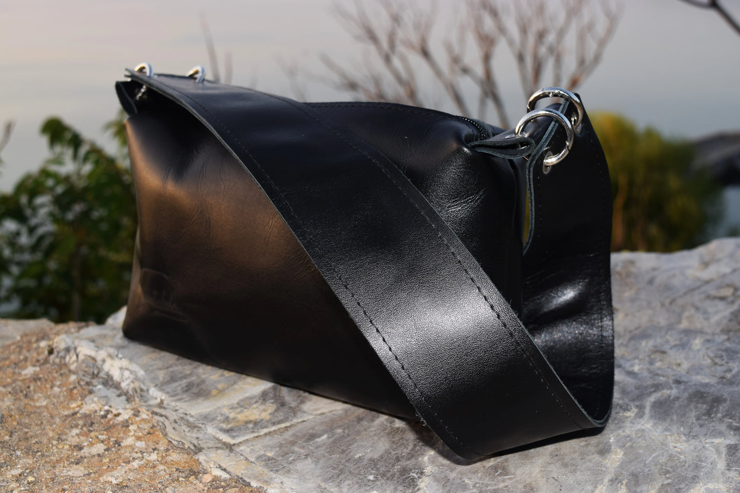 Luxurious wide-strap handbag in premium black Italian leather black stitching, black zipper black is a timeless luxury by Santebela.