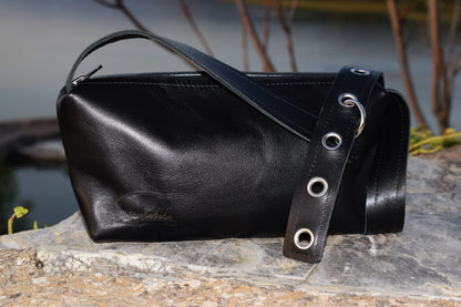 Black Italian leather bag with small detailing that embodies luxury and compassion  personally handcrafted by Santebela team