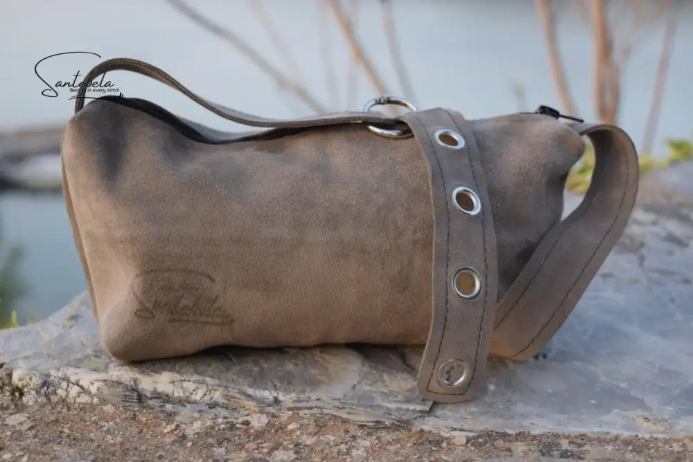 Handcrafted Luna crossbody bag in soft gray leather with subtle detailing. Santebela handcrafting