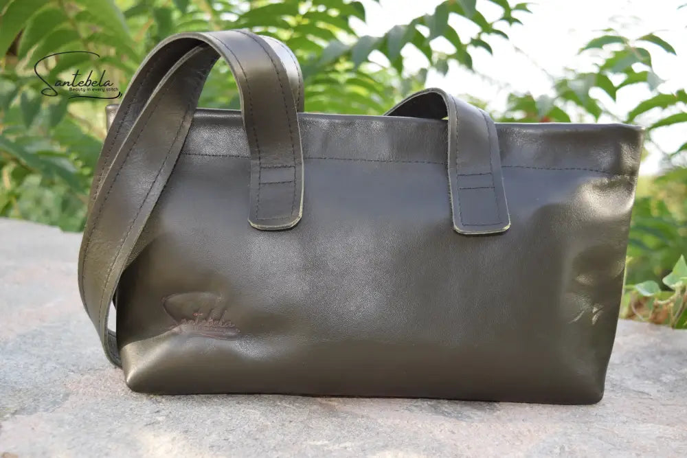 Lifestyle shot of the Dark Green Olive Leather Tote Bag, styled with elegance and versatility for everyday wear, by Santebela